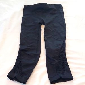 Athleta work out Leggings Black with netting on the bottom. Size Small.